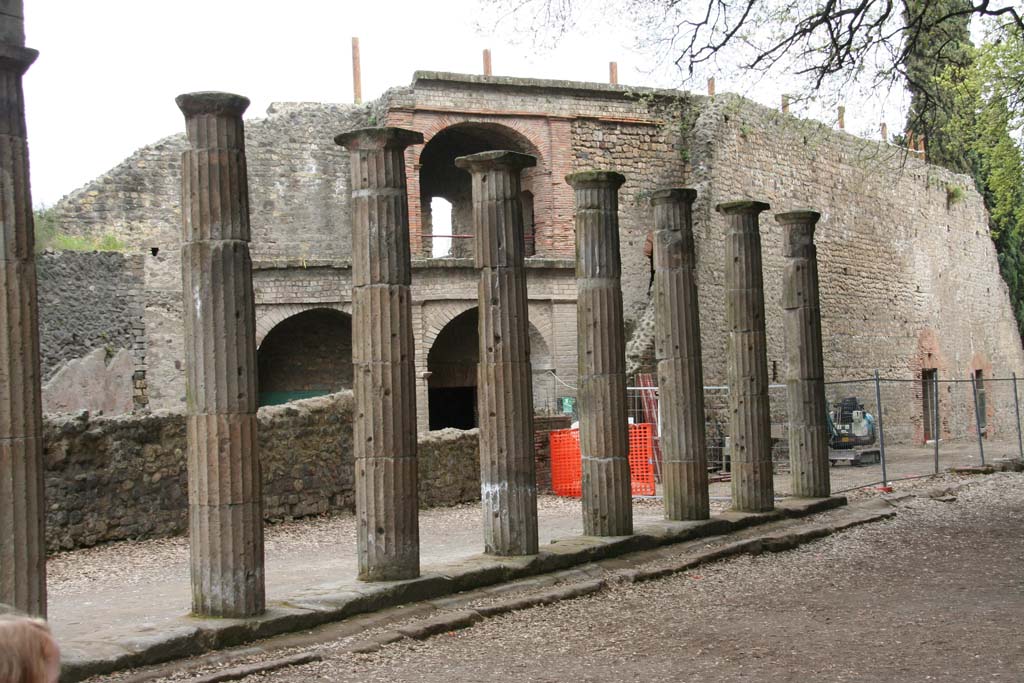VIII.7.30 Pompeii. April 2010. Portico, looking south at east side, with west side of Large Theatre behind columns. 
Photo courtesy of Klaus Heese.
