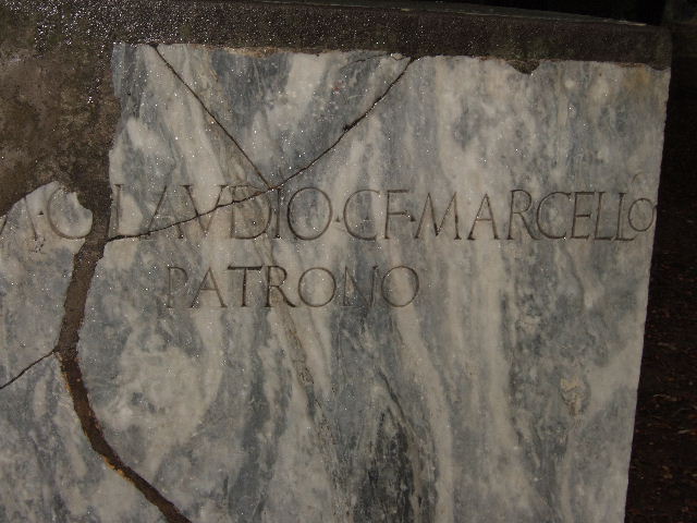 VIII.7.30 Pompeii. December 2005. Triangular Forum. Inscription on marble statue base
M. CLAUDIO C F MARCELLO
PATRONO
To Marcus Claudius Marcellus, son of Gaius, patron.
Marcellus was nephew and son in law to Augustus.
See Cooley, A. and M.G.L., 2004. Pompeii : A Sourcebook. London : Routledge. (p.133, F101).