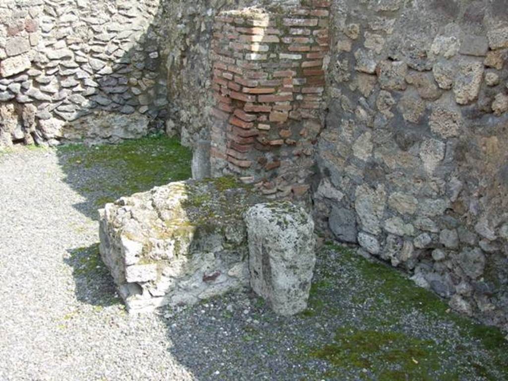 IX.1.2 Pompeii.  March 2009.  South wall, with base for stairs to upper floor, and Latrine underneath.