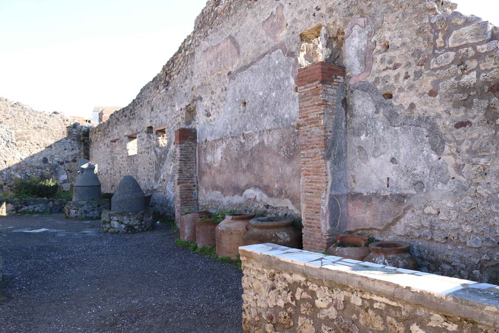 IX.1.3 Pompeii. October 2020. Looking towards south wall at rear of marble counter. Photo courtesy of Klaus Heese.