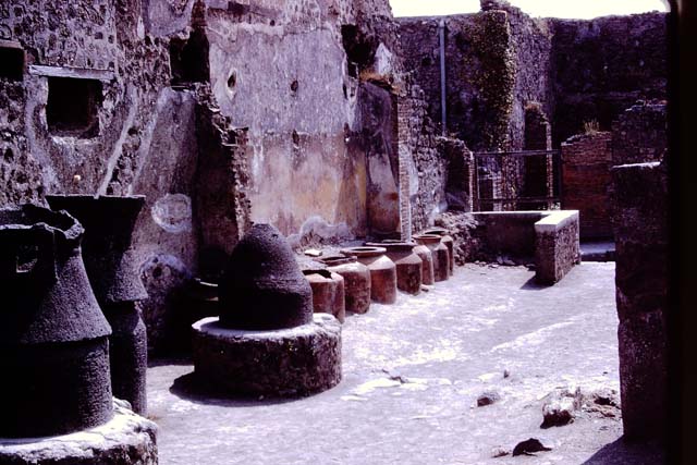 IX.1.3 Pompeii. Pre-1943. 
According to Warscher, this photo shows a structure on “the north-east corner of the second division.” 
She wrote, “If I am not mistaken here are the remains of a kneading trough.”
See Warscher, T. Codex Topographicus Pompeianus, IX.1. (1943), Swedish Institute, Rome. (no.8), p. 21.
