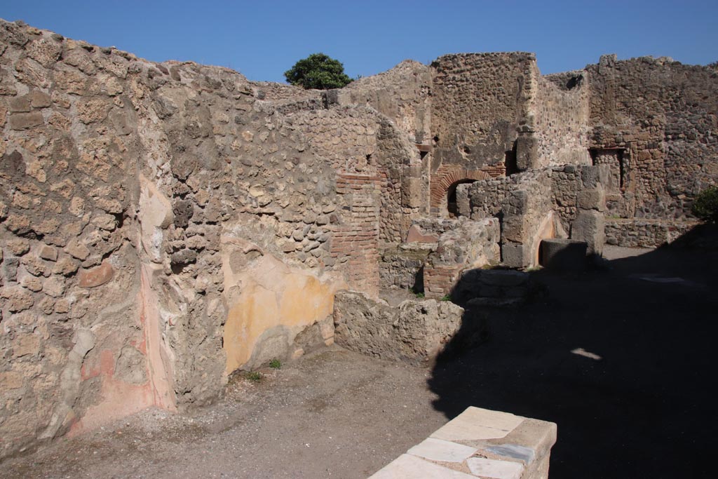 IX.1.3 Pompeii. October 2022. Looking north-east towards north wall of bakery shop. Photo courtesy of Klaus Heese