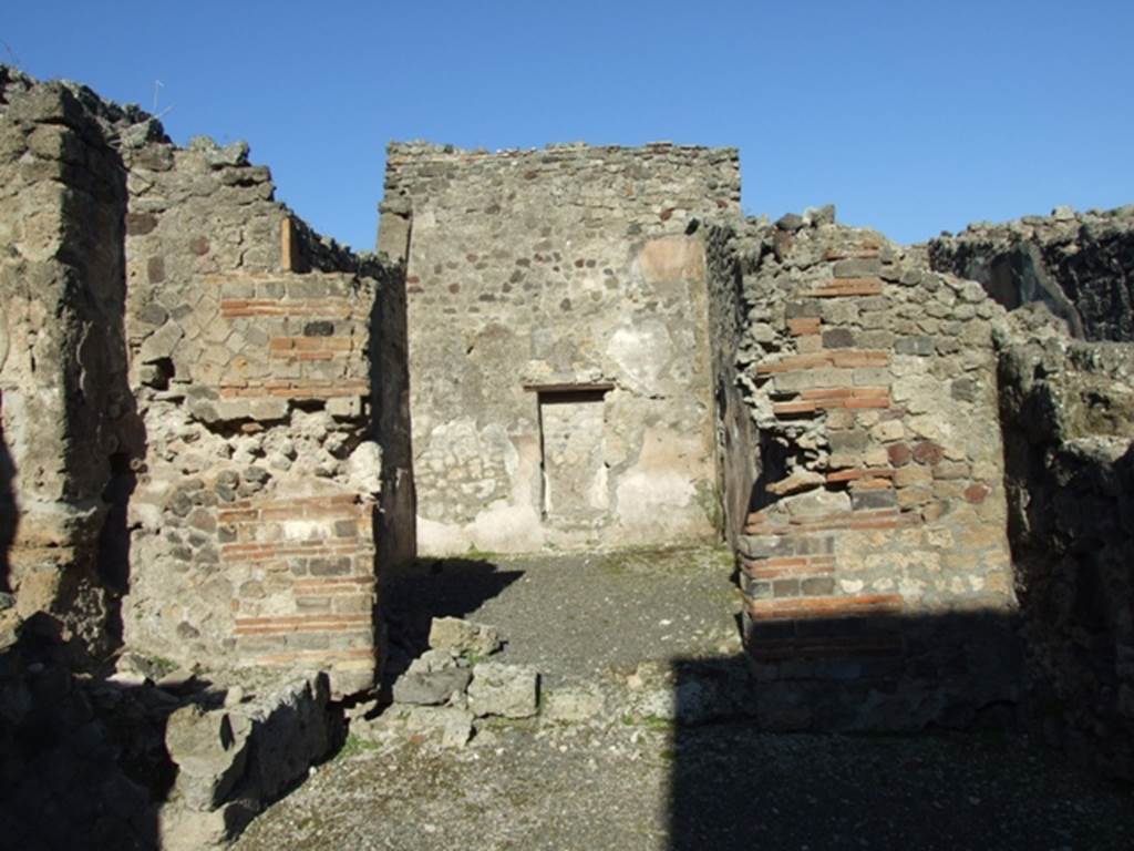 IX.1.6 Pompeii. March 2009. Rear room for customers reached by two steps, according to Fiorelli.