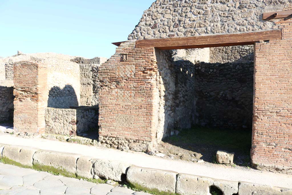 IX.1.13, on left, and IX.1.14 on right, Pompeii. December 2018. Looking towards doorways. Photo courtesy of Aude Durand.
