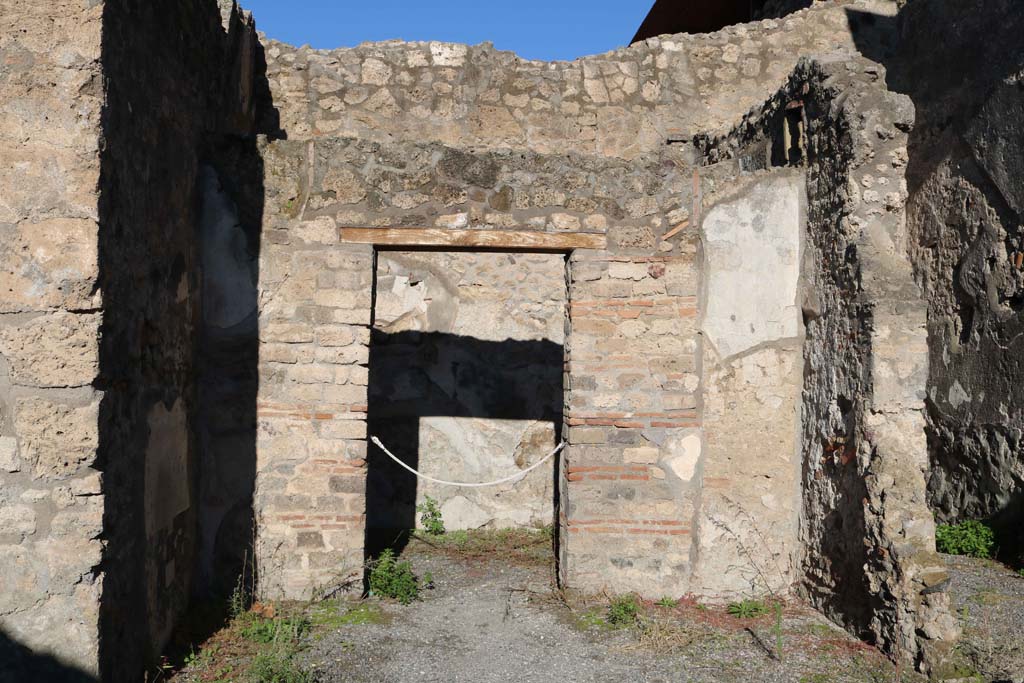 IX.1.18 Pompeii. December 2018. 
Looking north across area that would have been an open tablinum, towards doorway to cubiculum. Photo courtesy of Aude Durand.

