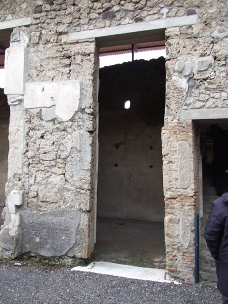 IX.1.20 Pompeii.  December 2007.  Doorway to Room 17.  On the rear wall can be seen the traces of shelving.
