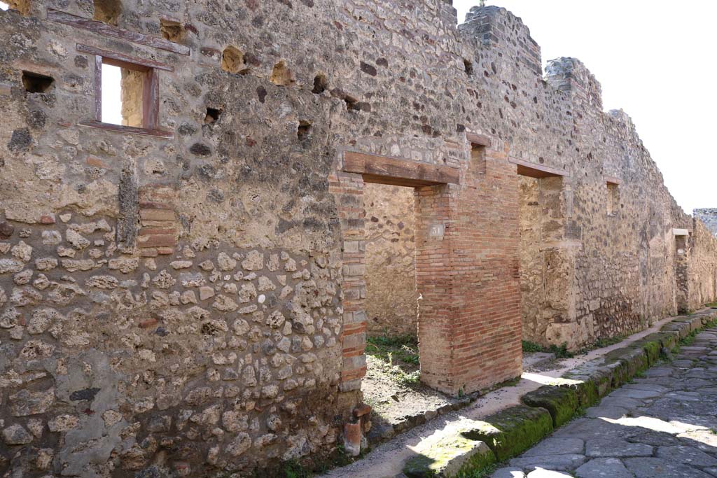 IX.1.31 Pompeii, on left. December 2018. 
Looking towards entrance doorway on south side of Vicolo di Balbo. Photo courtesy of Aude Durand.

