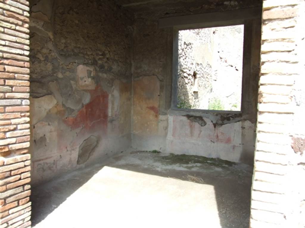 IX.2.5 Pompeii. March 2009. Doorway to triclinium, looking towards north-east corner, and window to garden in east wall. In this room, the zoccolo would have been black, the central panel on the walls was red, the side panels were yellow. According to Sogliano, the paintings found in this room were – Ariadne abandoned (p.97, no.535), A bust of Paris wearing a green heat, with cupid on his right shoulder (p.105, no.558), A bust of Helen, turning to the left, in response to no.558, faded and vanishing (p.108, no.567), Cimone and Perona (p.121, no.599) now in Naples Museum, inv. no: 115398.
See Sogliano, A., 1879. Le pitture murali campane scoverte negli anni 1867-79. Napoli: Giannini. 


