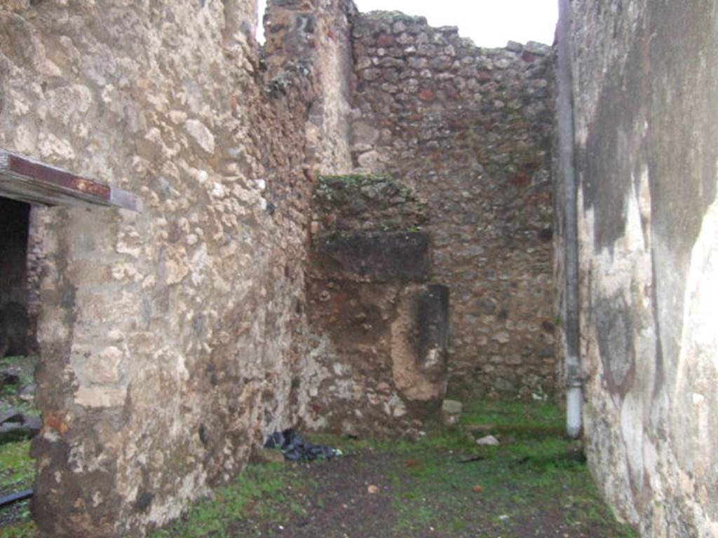 IX.2.8 Pompeii. December 2005. Looking east to small storeroom and kitchen with latrine. 
The doorway on the left linked to IX.2.7.
