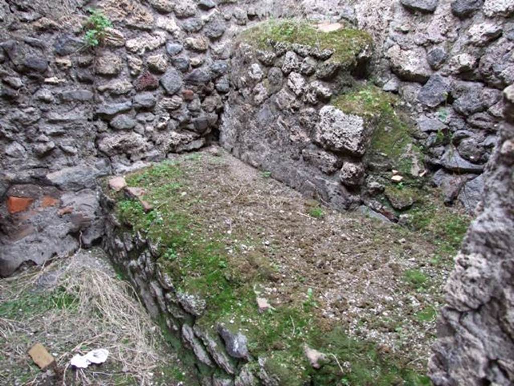 IX.2.10 Pompeii. December 2007. Kitchen on north-east side of the peristyle. Stone bench on east side.