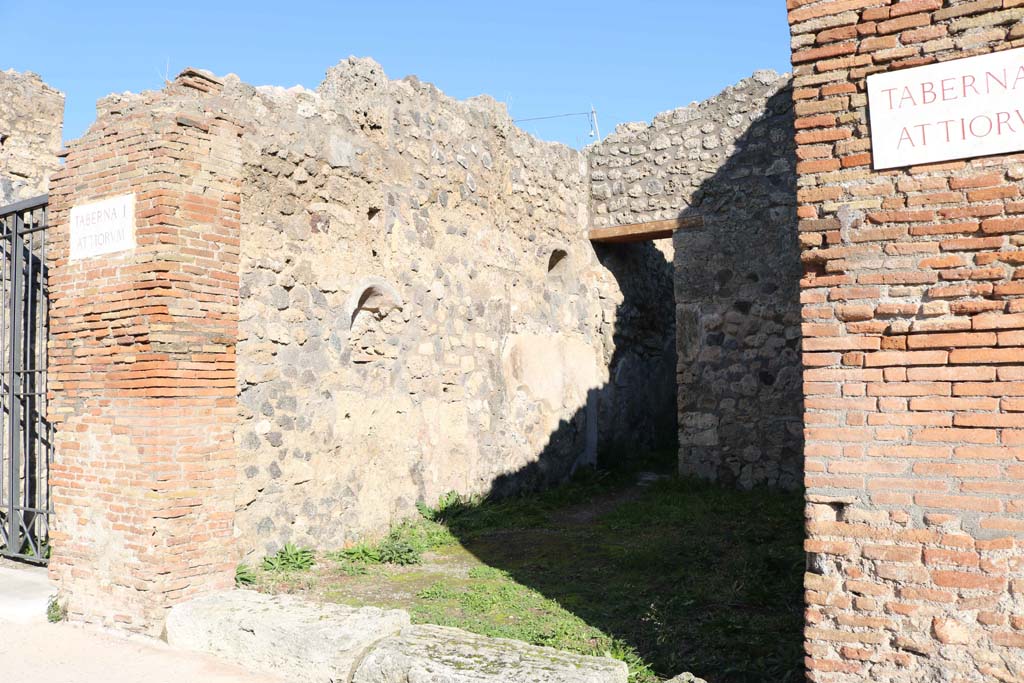 IX.2.11 Pompeii. December 2018. Looking east to entrance doorway and north wall of workshop. Photo courtesy of Aude Durand.

