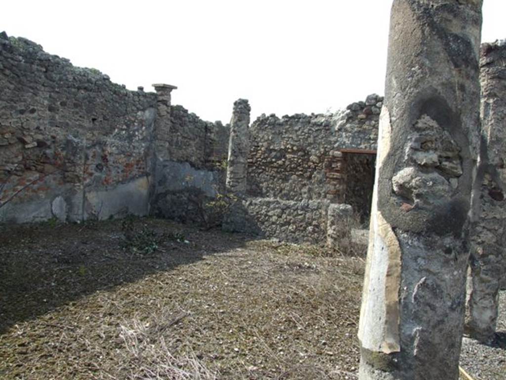 IX.2.17 Pompeii. March 2009. Room 9, garden area. Looking north-west towards north side and columns at the west end. According to Boyce, the two columns at the west end of the north row were connected by a low wall. On the south side of this wall, facing the open area, was painted in red a simple aedicula with pediment. Within the aedicula were painted two yellow serpents confronted at an altar. 
See Boyce G. K., 1937. Corpus of the Lararia of Pompeii. Rome: MAAR 14. (p. 81, no. 397) 
