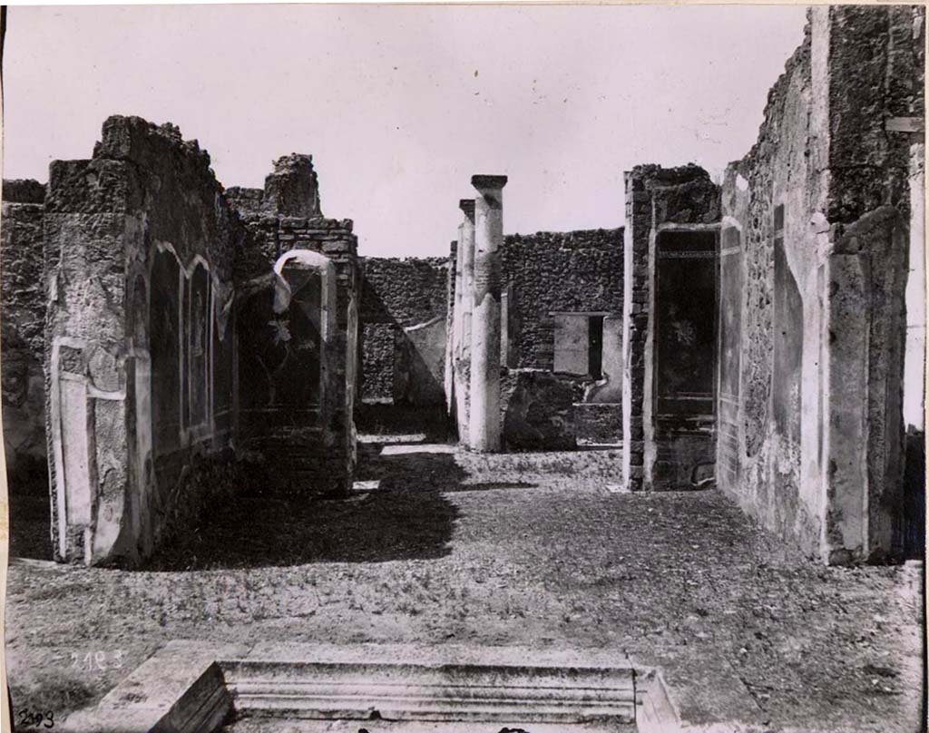 IX.2.18 Pompeii. Old undated photograph of room 5, tablinum, looking into garden area.
This old photograph shows the three painted walls: in the middle of the south wall was Ares enthroned, flanked on the east side panel by a vignette of a flying figure.
This probably was repeated by the panel on the west side, but which was incomplete at that place.
In the west wall, the panels on either side of the doorway to the garden area showed a vignette of a flying cupid.
On the north wall, there were panels with vignettes of flying figures. In the centre of the north wall would have been a large gap.
See Warscher, T. Codex Topographicus Pompeianus, IX.2. (1943), Swedish Institute, Rome. (no.97.), p. 178.

