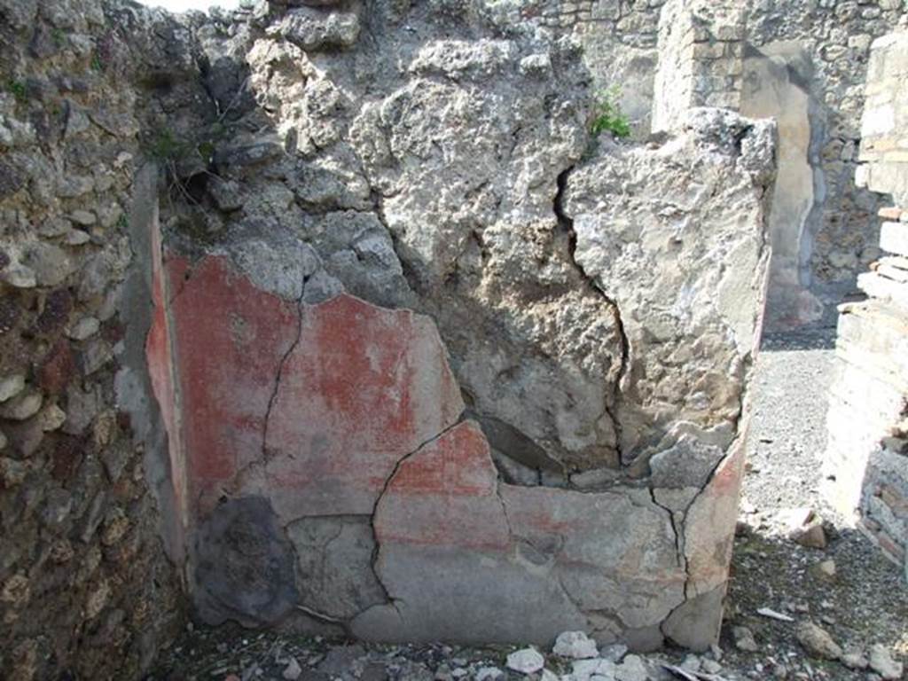 IX.2.18 Pompeii. March 2009. Room 6, north wall of cubiculum. The zoccolo was faded, whilst the red panels in the middle zone were outlined in very fine guide lines, and separated by a narrow band.
