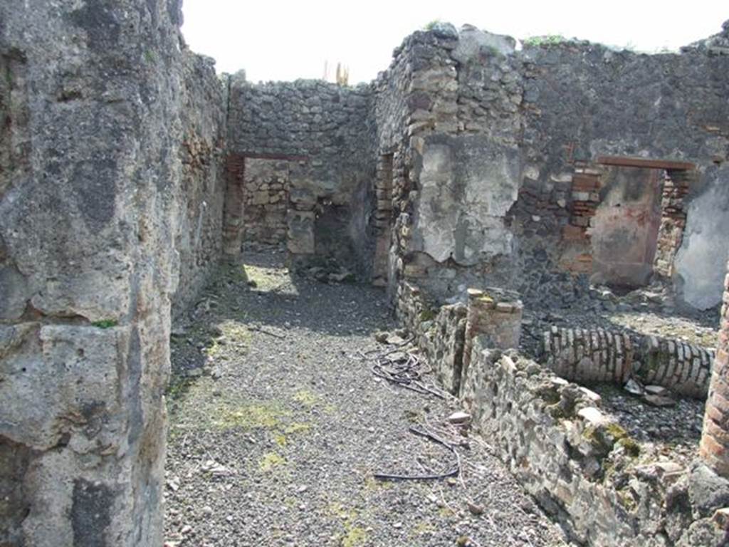 IX.2.18 Pompeii. March 2009. Room 11, garden area.  Looking west along the south portico, towards kitchen area. On the right are the doorway and window of the cubiculum or triclinium, room 10.
