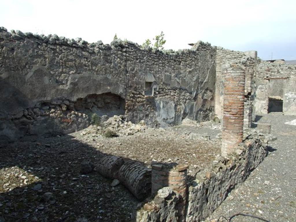 IX.2.18 Pompeii. March 2009.  Room 11.  Garden area.  Looking east along line of three columns and low wall, towards East Portico.