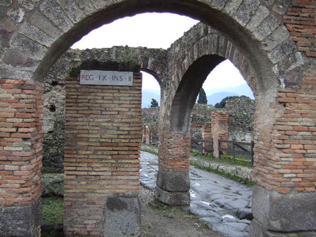 IX.2.29 Pompeii. December 2005. Looking south through arcade, along Via Stabiana.