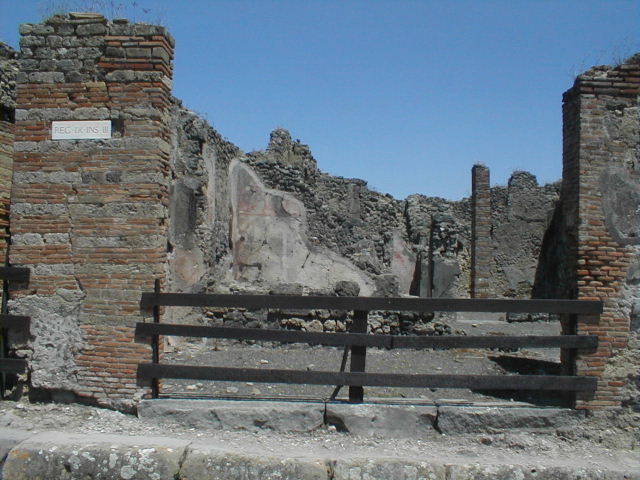 IX.3.1 Pompeii. May 2005. Entrance, looking east from Via Stabiana.
In September 1843, graffiti were found painted on the pilaster on the left:

Cn(aeum)  Helvium  Sabin(um)
aed(ilem)  o(ro)  v(os)  f(aciatis)    [CIL IV 857]

C(aium)  Calventium  Sittium
II vir(um)  i(ure)  d(icundo)  Uboni  vigula    [CIL IV 858]

Also found in September 1843, on the pilaster on the right, between IX.3.1 and IX.3.2 a graffito was found reading

M(arcum)  Holconium
Priscum  aedil(em)  o(ro)  v(os)  f(aciatis)    [CIL IV 860]

See Pagano M. and Prisciandaro, R., 2006. Studio sulle provenienze degli oggetti rinvenuti negli scavi borbonici del regno di Napoli. Naples: Nicola Longobardi.  (p.159)
