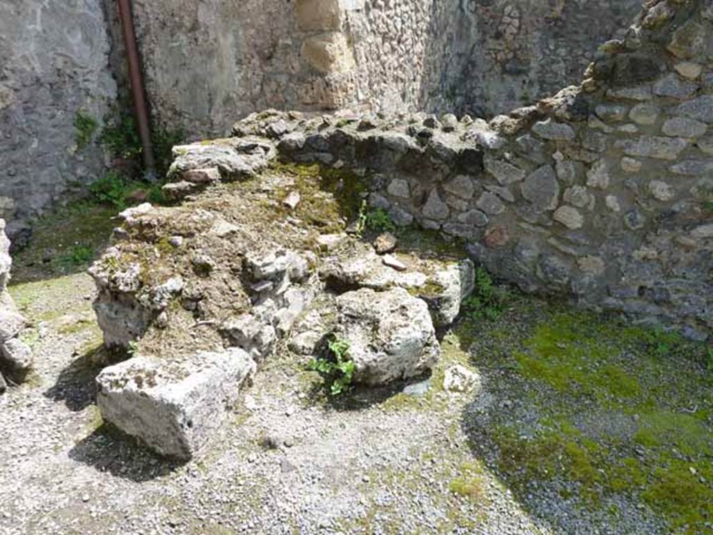 IX.3.3 Pompeii. May 2010. Steps to upper floor in south-east corner of shop. The area at the rear is part of IX.3.4.