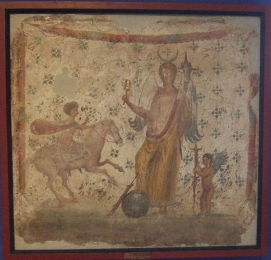 IX.3.7 Pompeii.  Picture of Isis Fortuna with horn of plenty and sistrum and with a foot on a globe. 
To the right is Hesperus and left is Helios or Harpocrates - Helios.
Now in Naples Archaeological Museum, where it is shown as from IX.3.15. 
Fröhlich says this picture was found on the north wall of the shop IX.3.7.
He points out that the painting was described by Panofka in 1847, so it could not be IX.3.15 which was first excavated in 1861.
See Fröhlich, T., 1991, Lararien und Fassadenbilder in den Vesuvstädten.  Mainz: von Zabern.  (L101: p.294).

Others believe the painting of Isis-Fortuna (MN 8836) was found in 1847 in IX, iii, 15 on the north wall of a cubiculum.  
It was discovered while carrying out work on one of the walls of the Casa di Suonatrici which joined the two houses. 
Our thanks to Raffaele Prisciandaro for his help in identifying the following sources:
Casa di Philocalus; parete N del cubicolo; CIL 04, 882 (197); 
Bulletino Archeologico Italiano, 1, 1862, n. 20, 1862, pp. 159 160; 
Panofka, BdI 1847, pp. 127-128 “nell’appoggiar una delle mura della casa delle Suonatrici si è scoperta al muro della casa accanto una pittura …” 

According to PPM, there was no agreement on whether the painting depicting Isis-Fortuna, now at Naples Museum, came from this shop.
See Bragantini I., in 1990-2003. Pompei: Pitture e Mosaici.  Roma: Istituto della enciclopedia italiana, Vol. IX, p.314, p. 335.

