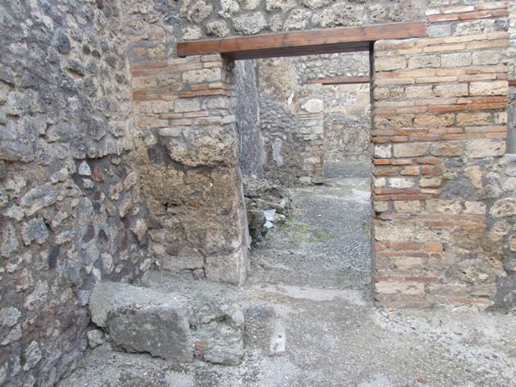 IX.3.13 Pompeii. March 2009.   North wall of caupona, with remains of stairs in north-west corner, and doorway to dwelling. On the west wall, on the left, under the stairs would have been a lararium painting, now disappeared.  Luckily both Fiorelli and Sogliano wrote a good description. 
Fiorelli told us that there was a Genius flanked by Lares, the caricature of a male head, and two gladiators in combat.  Sogliano reported that the painting was done in red monochrome on white plaster, and showed a Genius with patera and corncupocia, sacrificing at the altar in the middle of two Lares with rhyton and situla. 
See Pappalardo, U., 2001. La Descrizione di Pompei per Giuseppe Fiorelli (1875). Napoli: Massa Editore. (p. 146)
See Sogliano, A., 1879. Le pitture murali campane scoverte negli anni 1867-79. Napoli: (p.11)
See Boyce G. K., 1937. Corpus of the Lararia of Pompeii. Rome: MAAR 14. (p.83-4) 
See Jacobelli, L., 2003. Gladiators at Pompeii. Rome: L’Erma di Bretschneider. (p. 82)
