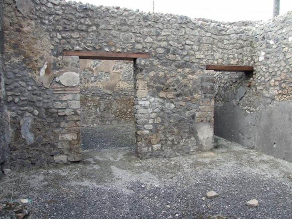 IX.3.13 Pompeii. March 2009. Looking north, doorway to triclinium, on left, and corridor to rear, on right.