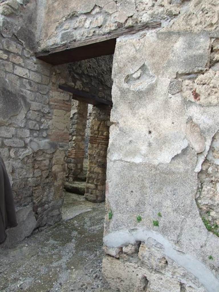 IX.3.15 Pompeii. March 2009. Doorway to room 7.  Corridor, with door to room 5 
