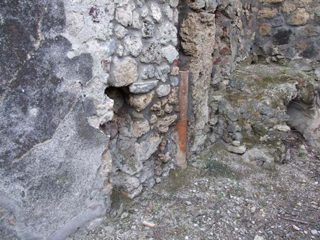 IX.3.15 Pompeii.  March 2009.  Room 12.  West wall in north west corner of portico.