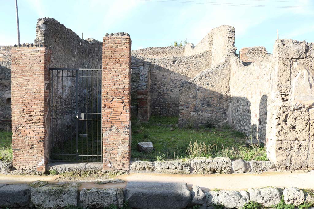 IX.3.15, on left, and IX.3.16, on right, Pompeii. December 2018. 
Looking north to entrance doorways, Photo courtesy of Aude Durand.
