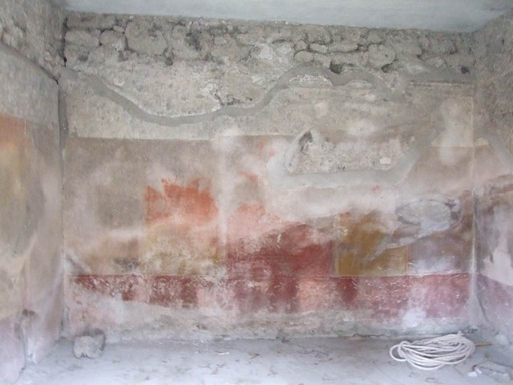 IX.3.19 Pompeii. December 2007. Room 12, west wall of room on west side of room 10.
The zoccolo (or lower plinth) was purple/violet, the middle zone of the wall had a red central aedicula. The upper zone of the wall was white and finished with a cornice of moulded stucco.
