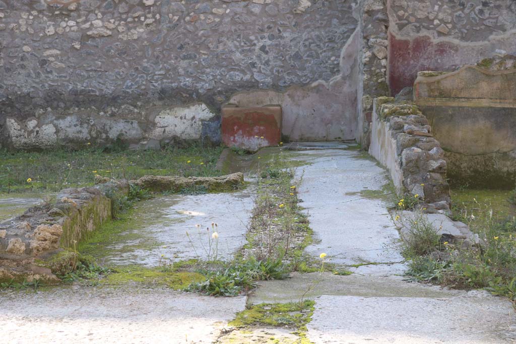 IX.3.22 Pompeii. December 2018. 
Looking towards north-west corner, with room with black painted wall decorations on east side of room with red decorations.  
Photo courtesy of Aude Durand.
