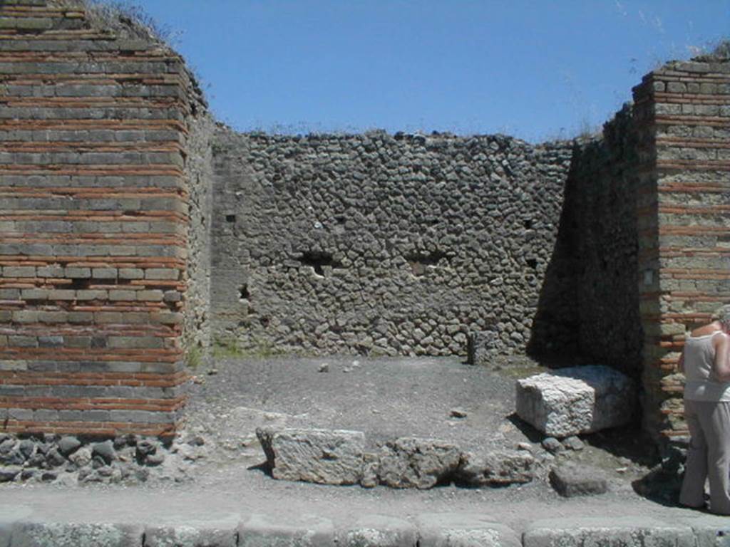 IX.4.6 Pompeii. May 2005. Entrance, with large limestone block, probably part of a podium .