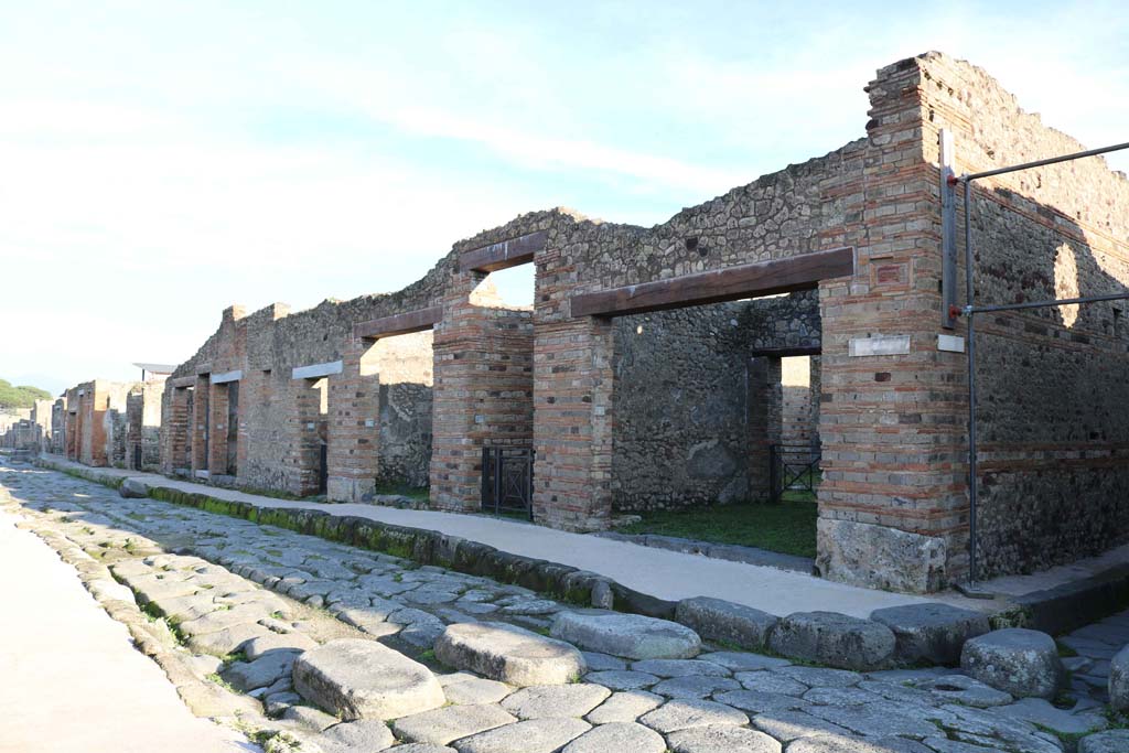 Via di Nola, Pompeii, south side. December 2018. 
Looking east along Insula 5, of Reg. IX, with IX.5.1, on right, next to entrance to Vicolo di Tesmo. Photo courtesy of Aude Durand.

