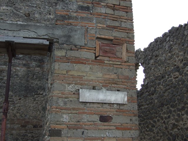 IX.5.1 Pompeii. December 2007. Terracotta wall plaque of phallus on wall outside IX.5.1.  