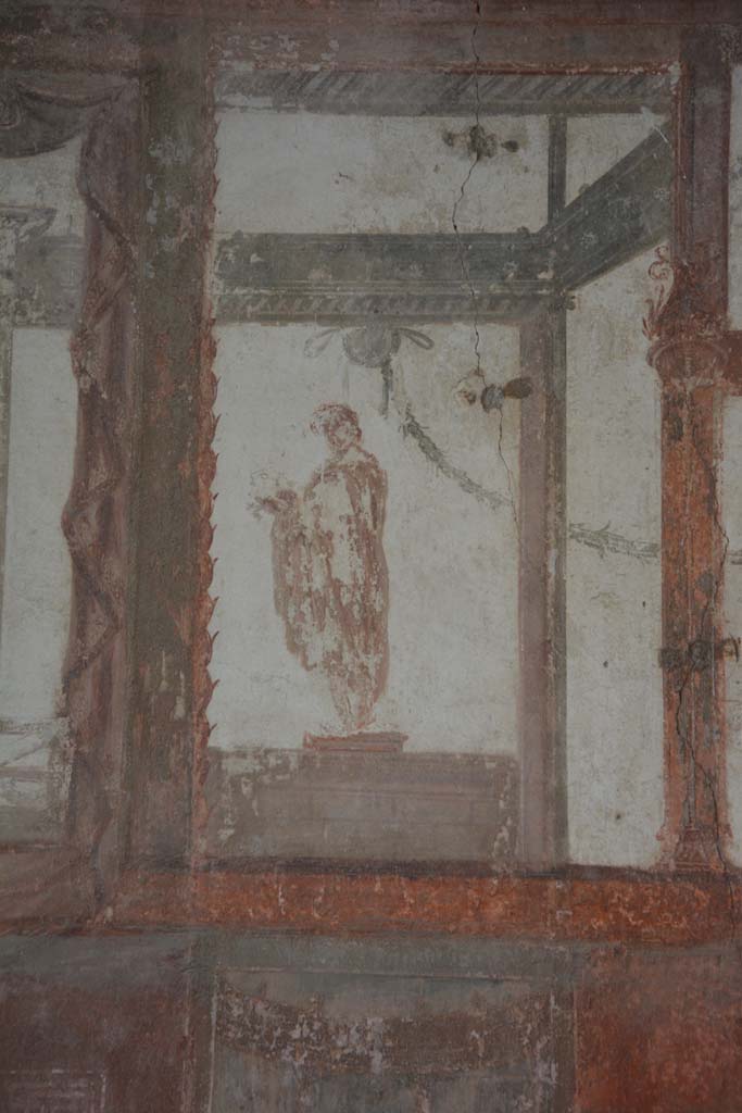 IX.5.6 Pompeii. May 2017. 
Room i, upper wall, detail of figure on south side of central panel.      
Foto Christian Beck, ERC Grant 681269 DCOR.

