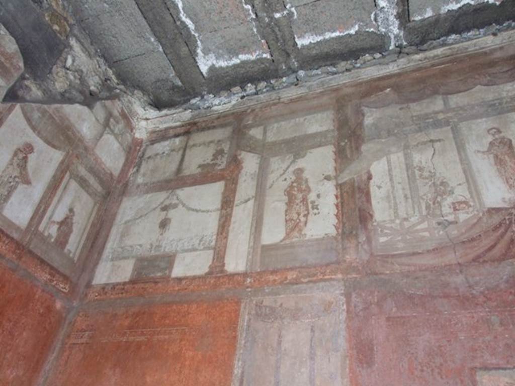 IX.5.6 Pompeii. December 2007.  Room 10, east wall of tablinum. Wall painting of figures or gods at high level.
