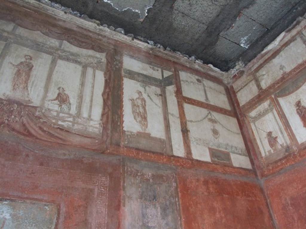 IX.5.6 Pompeii. December 2007. Room 10, east wall of tablinum. Wall painting of figures or gods at high level.
