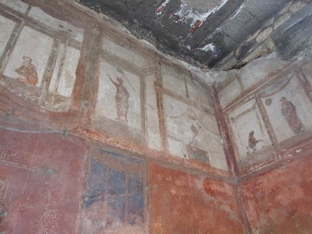 IX.5.6 Pompeii. December 2007. Room 10, upper west wall and north-west corner of tablinum. Wall painting of figures or gods at high level.
