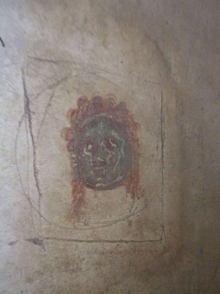 IX.5.6 Pompeii. December 2007. Room 8, wall painting of a mask in corridor on east side of tablinum.  

