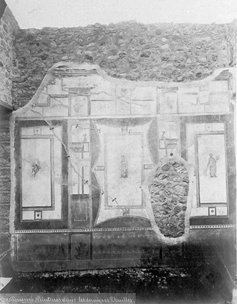 IX.5.11 Pompeii. Old photo c.1880. Room 6, oecus, east wall. 
A floating figure and two muses, Clio with an open scroll and Thalia with comic mask.
See Schefold, K., 1962. Vergessenes Pompeji. Bern: Francke. (Fig.134 [f]: Ostwand)
