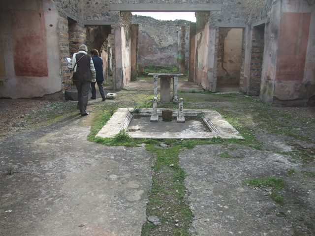 IX.5.11 Pompeii.  December 2007. Room 1.  Atrium.  Looking south across impluvium to Tablinum.