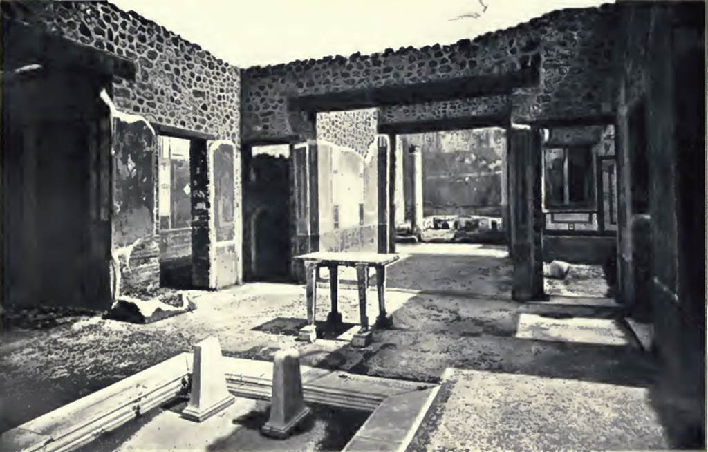IX.5.11 Pompeii. 1900. Atrium. Looking south-east across impluvium to tablinum. According to Presuhn, on the left side of the atrium is the stone wall on which the remains of the bottom of an iron chest were found. In this was found a gold ring. Above this was found a painting of Summer. On the opposite side of the atrium was a painting of Spring. The paintings of Autumn or Winter had disappeared. See Presuhn E., 1882. Pompeji: Die Neuesten Ausgrabungen  von 1874 bis 1881. Leipzig: Weigel. (VIII). 