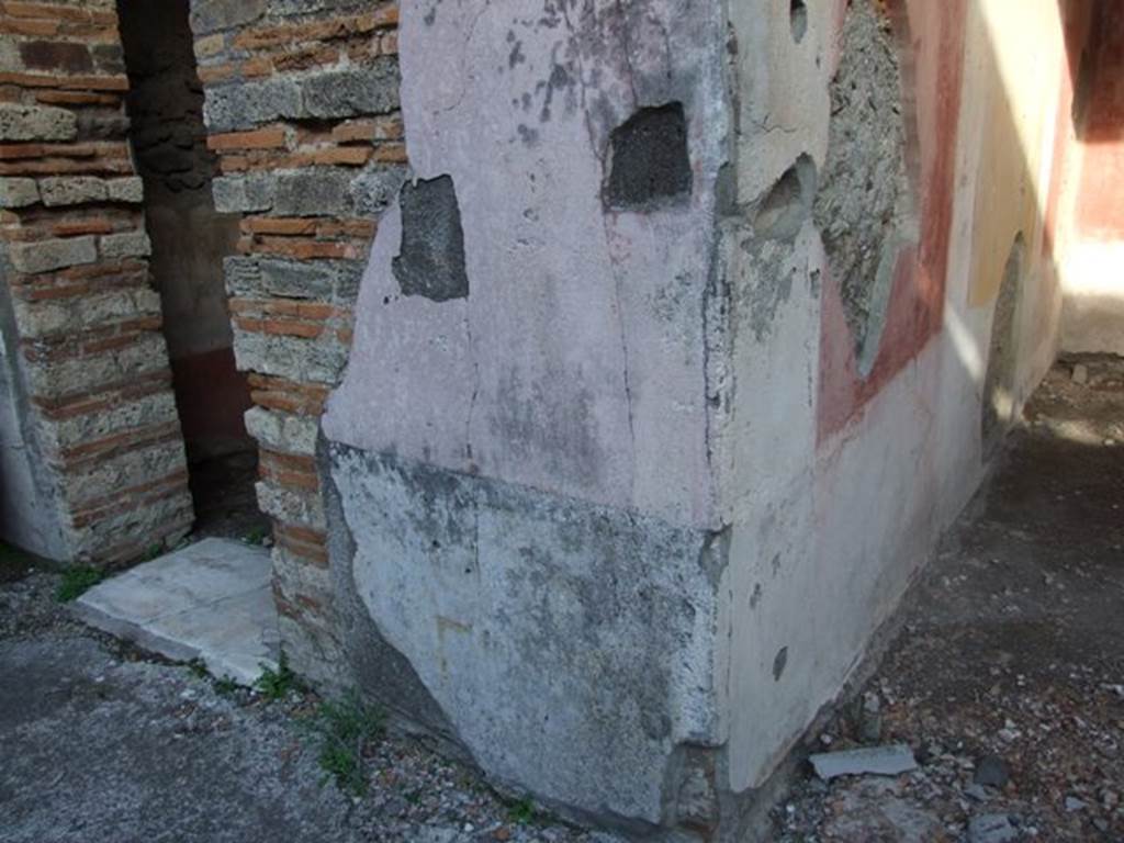 IX.5.11 Pompeii. December 2007. Wall on east side of atrium, between doorway to room 2, and north wall of room 3. The north wall of room 3, the east ala, had a black zoccolo with panels separated by narrow compartments. The middle of the walls had a central yellow panel with red side panels. Mau (BdI 1879 (p.197) thought that, almost certainly, on this pilaster facing the atrium would have been a personification of either autumn or winter, as was seen on the pilasters between rooms 3 and 4, and 7 and 8.  
