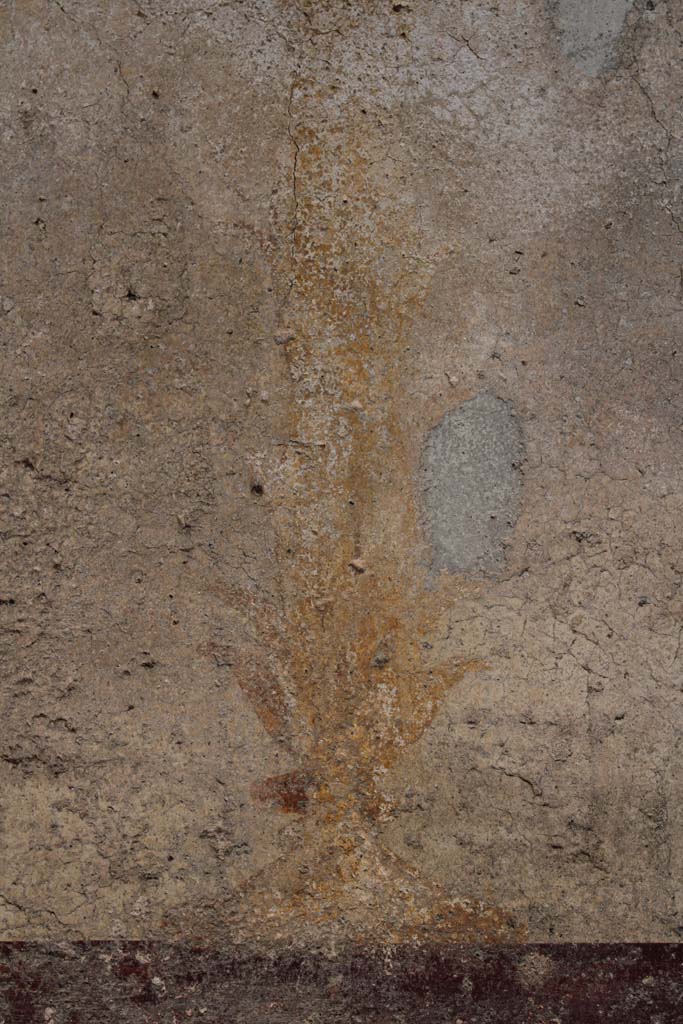 IX.5.16 Pompeii. May 2019. Cubiculum f’, base of painted candelabra on east wall.