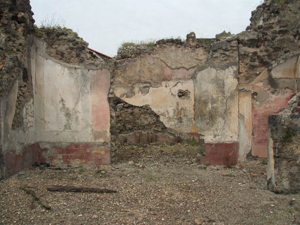 IX.5.18 Pompeii. May 2005. Room l (L) antecamera, in foreground, with room o, oecus at the rear. On the right, would be the site of the steps to the upper floor in a narrow storeroom, behind which was an alcove, capable of holding a seat or a bed: the floor of the alcove was raised. The zoccolo was dark red, the middle zone was painted with white panels edged with black bands, at the centre of which were medallions, of which three remained; one with a head of a Satyr crowned with rushes and a Cupid at his shoulder; another with the head of Apollo; and the third with the head of Diana (Artemis). To the north was a spacious room, decorated with red, yellow and white, in the centre of which were two rounds showing groups of Cupid with Psyche.
See NdS 1878, (p.269)
See Sogliano, A., 1879. Le pitture murali campane scoverte negli anni 1867-79. Napoli: Giannini. p. 27 (no.104), p.28 (no.112), p.43 (no.184), 
p.67 (no.395/6)
