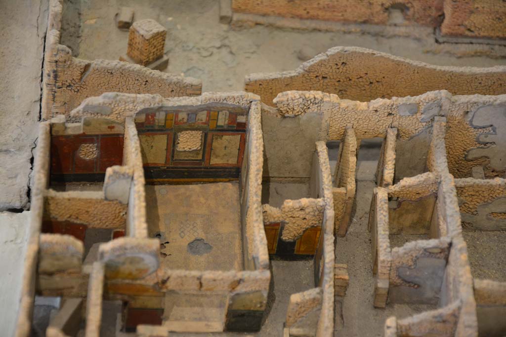 IX.5.18/19 Pompeii. July 2017. 
Looking west to rooms e and f in south-west corner, with doorways at IX.5.20/21, centre right, onto Vicolo di Tesmo. 
From cork model in Naples Archaeological Museum.
Foto Annette Haug, ERC Grant 681269 DÉCOR
