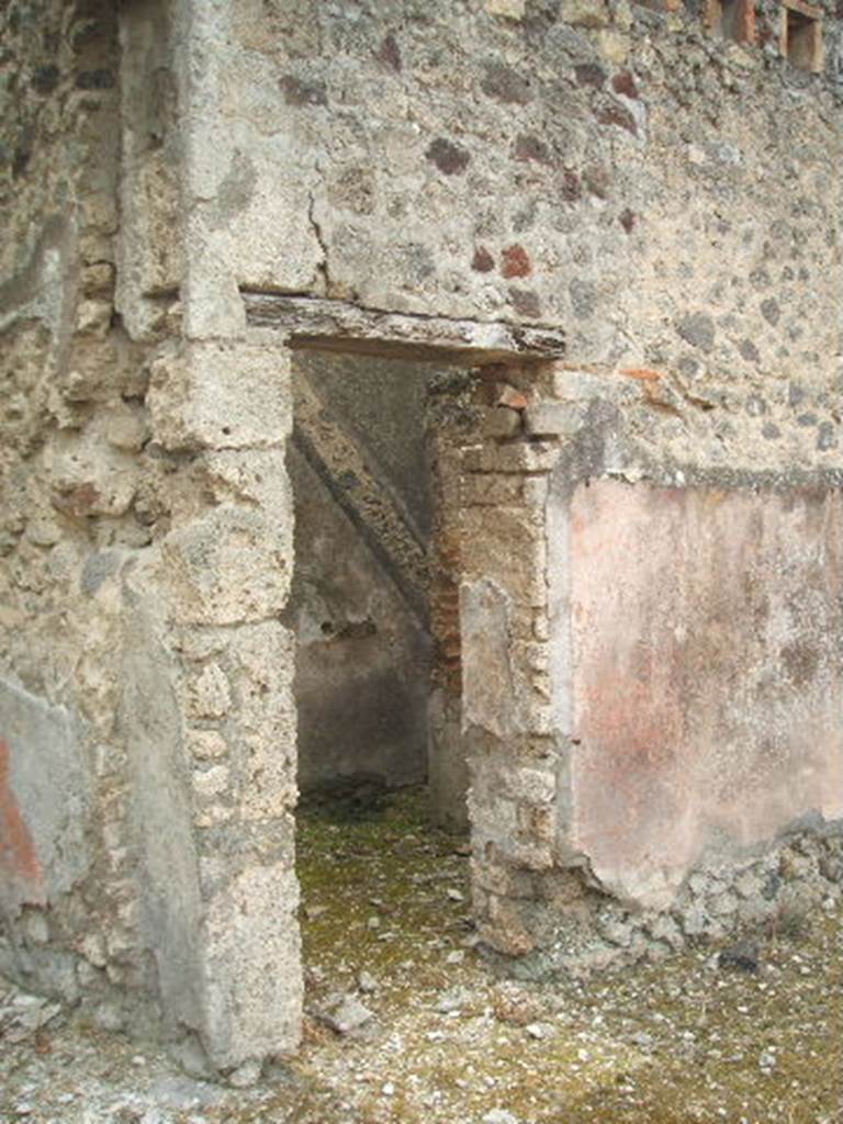 IX.5.18 Pompeii.  May 2005.  Room c.  Small room on west side of entrance corridor with outline of stairs in wall.