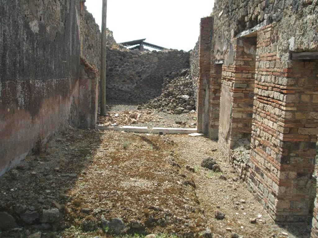 IX.6.3 Pompeii. July 2008. East wall of small garden area, with downpipe. Photo courtesy of Barry Hobson.