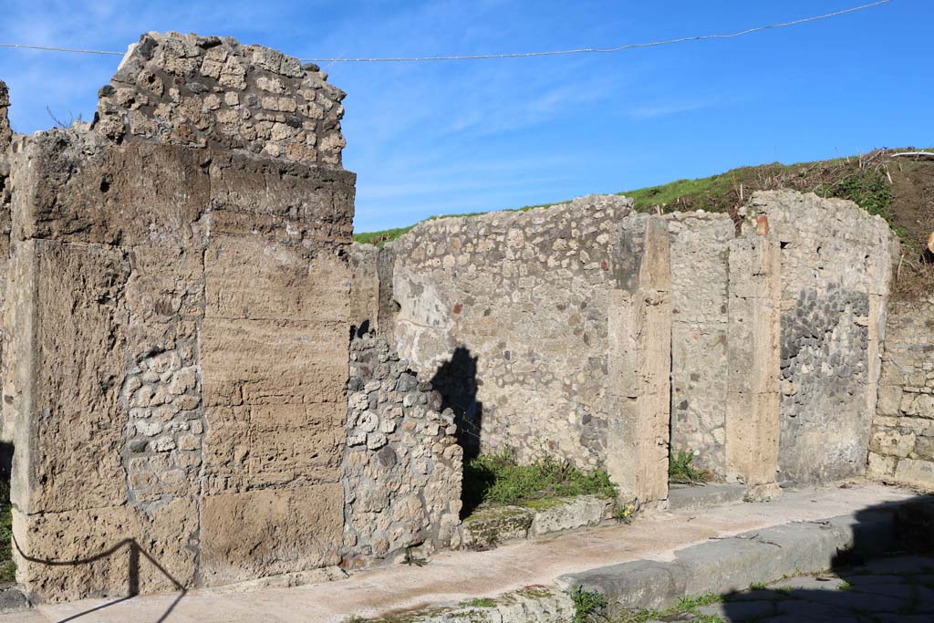 IX.6.f, Pompeii. December 2018. Looking north-east to entrance doorways, with IX.6.g, on right. Photo courtesy of Aude Durand.

