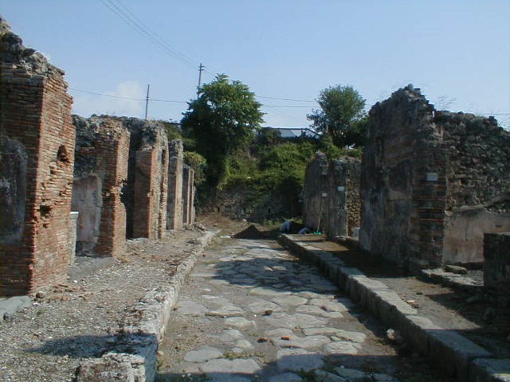 IX.6.a  Shop and dwelling  Linked to IX.6.1

IX.6.a                           Roadway looking east                                IX.7